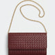 Estee Lauder Burgundy woven clutch bag